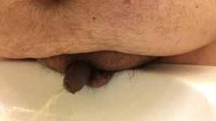 Chub Pissing into Sink